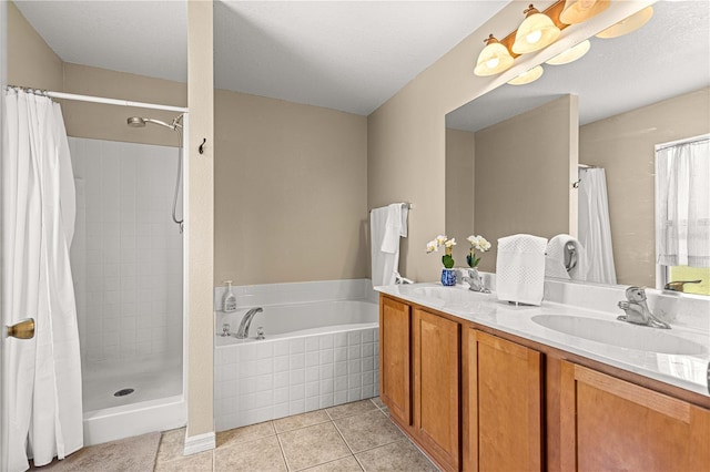 full bathroom featuring tile patterned floors, a bath, a tile shower, and double vanity