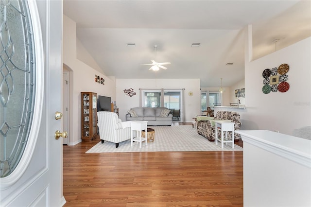 5920 SW 88th Pl, Ocala, FL 34476 - living room featuring lofted ceiling, wood finished floors, a ceiling fan, and arched walkways