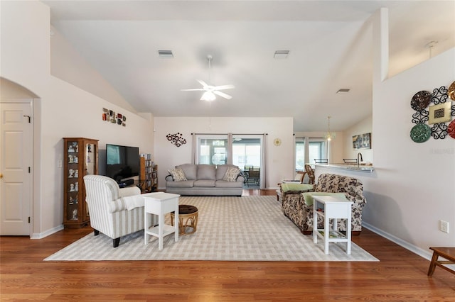 5920 SW 88th Pl, Ocala, FL 34476 - living area featuring a ceiling fan, wood finished floors, high vaulted ceiling, baseboards, and arched walkways