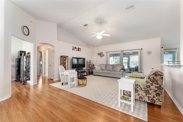 5920 SW 88th Pl, Ocala, FL 34476 - living area featuring ceiling fan, arched walkways, wood finished floors, high vaulted ceiling, and baseboards