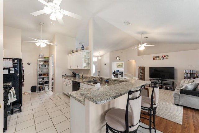 5920 SW 88th Pl, Ocala, FL 34476 - kitchen featuring a ceiling fan, vaulted ceiling, black appliances, open floor plan, and open shelves