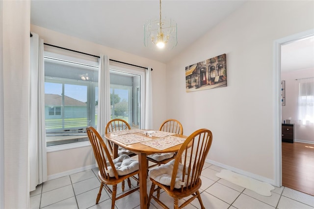 5920 SW 88th Pl, Ocala, FL 34476 - dining room with healthy amount of natural light, a chandelier, light tile patterned floors, baseboards, and vaulted ceiling