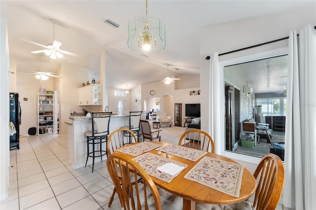 5920 SW 88th Pl, Ocala, FL 34476 - dining space with ceiling fan, light tile patterned floors, lofted ceiling, and a chandelier