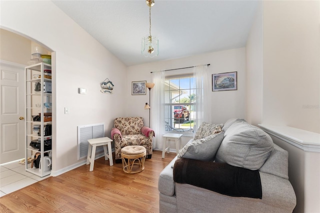 5920 SW 88th Pl, Ocala, FL 34476 - living area with vaulted ceiling, light wood finished floors, and arched walkways