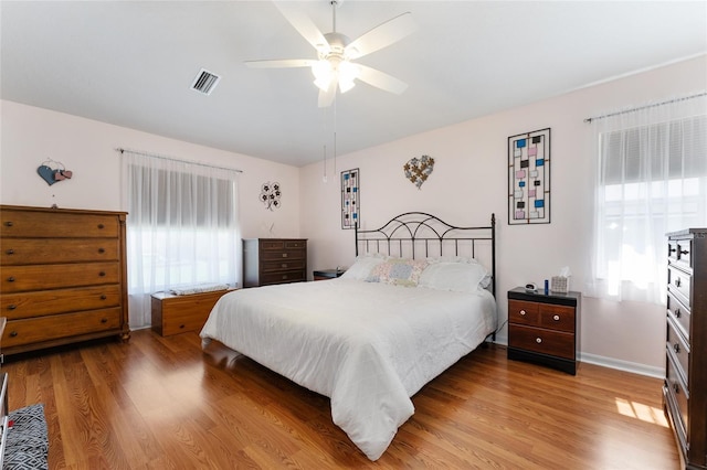 5920 SW 88th Pl, Ocala, FL 34476 - bedroom featuring wood finished floors, baseboards, and a ceiling fan