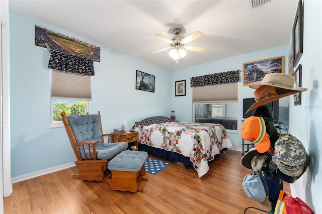 5920 SW 88th Pl, Ocala, FL 34476 - bedroom featuring wood finished floors, baseboards, and a ceiling fan