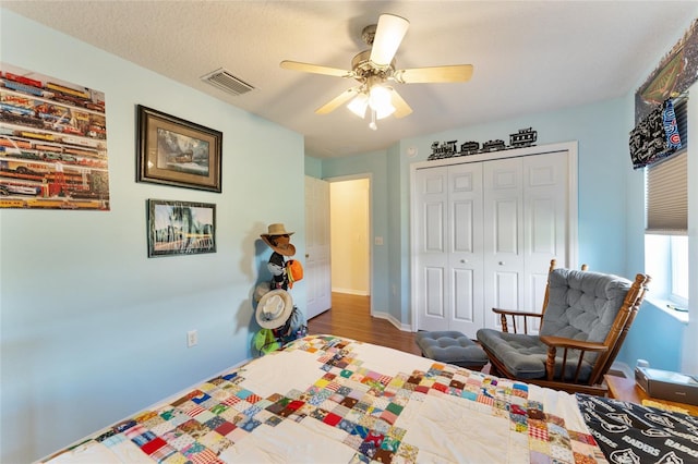 5920 SW 88th Pl, Ocala, FL 34476 - bedroom with a closet, wood finished floors, a ceiling fan, and baseboards