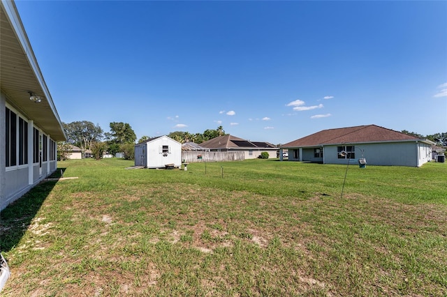 5920 SW 88th Pl, Ocala, FL 34476 - view of green lawn with a storage shed and an outdoor structure