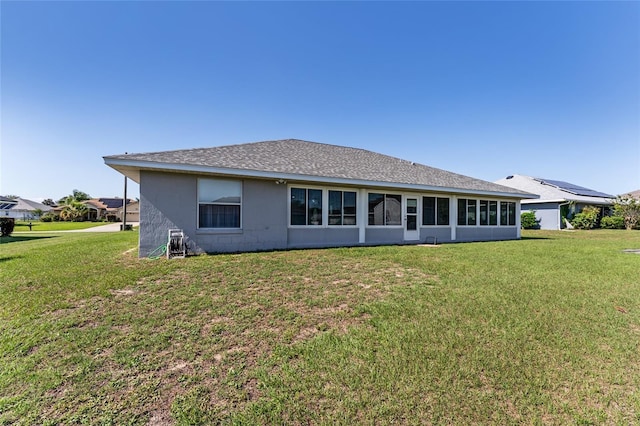 5920 SW 88th Pl, Ocala, FL 34476 - rear view of house featuring a yard and roof with shingles