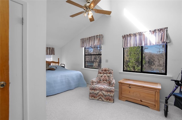 6620 S Merleing Loop, Floral City, FL 34436 - bedroom with carpet floors, multiple windows, vaulted ceiling, a ceiling fan, and baseboards