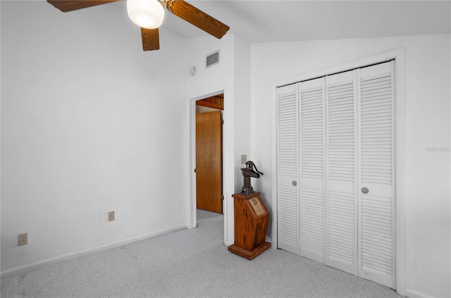 6620 S Merleing Loop, Floral City, FL 34436 - unfurnished bedroom featuring vaulted ceiling, carpet flooring, a closet, ceiling fan, and baseboards