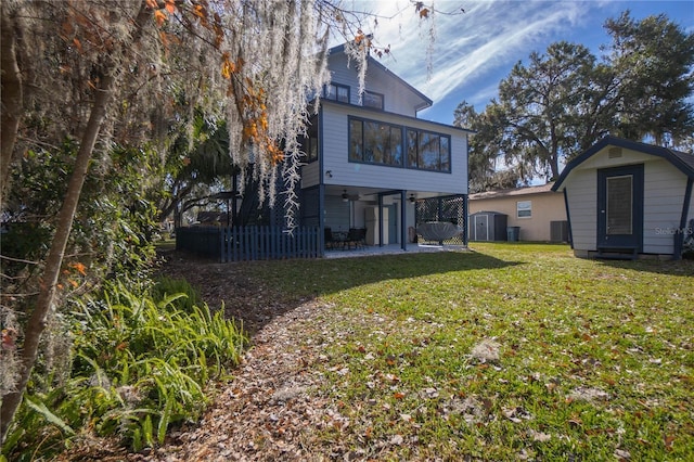 6620 S Merleing Loop, Floral City, FL 34436 - rear view of property with a shed, a patio, an outbuilding, a ceiling fan, and cooling unit