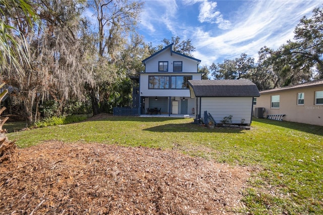 6620 S Merleing Loop, Floral City, FL 34436 - rear view of property with central AC, a patio, a yard, and roof with shingles
