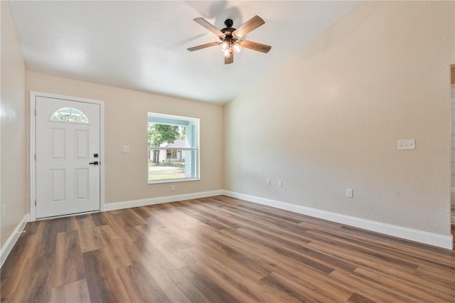 5193 NW 61st Ave, Ocala, FL 34482 - foyer entrance featuring dark wood-style floors, vaulted ceiling, ceiling fan, and baseboards