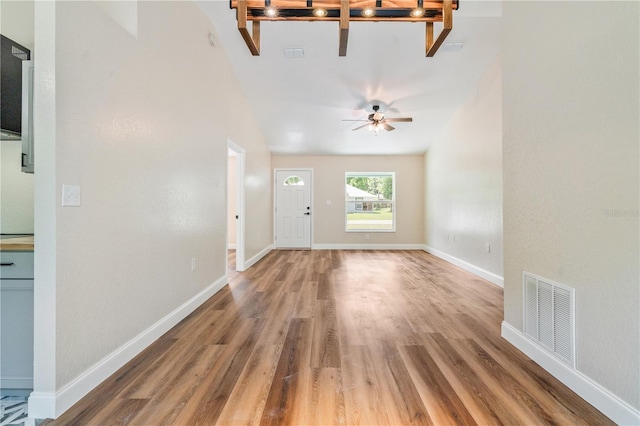 5193 NW 61st Ave, Ocala, FL 34482 - entryway featuring wood finished floors, a ceiling fan, baseboards, and vaulted ceiling