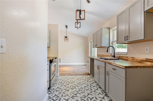 5193 NW 61st Ave, Ocala, FL 34482 - kitchen featuring gray cabinetry, wood counters, a sink, stainless steel range with electric cooktop, and light flooring