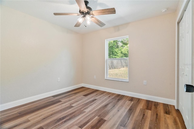 5193 NW 61st Ave, Ocala, FL 34482 - unfurnished bedroom featuring baseboards, wood finished floors, a closet, and a ceiling fan