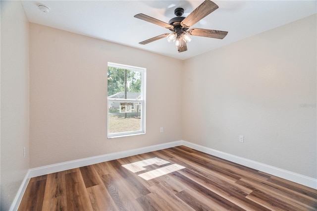 5193 NW 61st Ave, Ocala, FL 34482 - unfurnished room with baseboards, a ceiling fan, wood finished floors, and a smoke detector