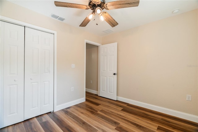 5193 NW 61st Ave, Ocala, FL 34482 - unfurnished bedroom with baseboards, wood finished floors, a closet, and ceiling fan