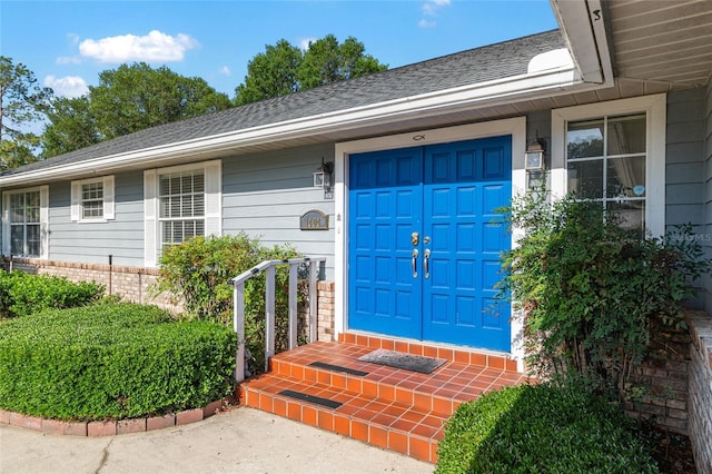 1404 SE 40th Ct, Ocala, FL 34471 - doorway to property with a garage, brick siding, and a shingled roof