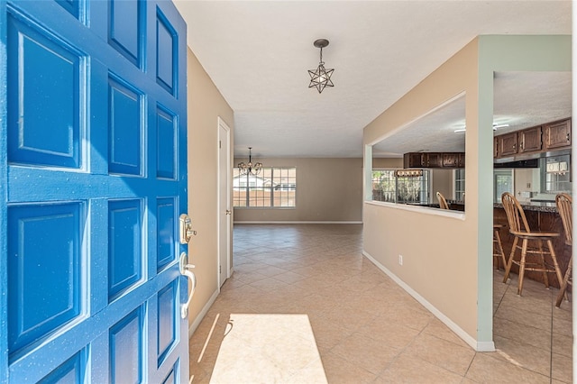 1404 SE 40th Ct, Ocala, FL 34471 - foyer with baseboards and light tile patterned floors