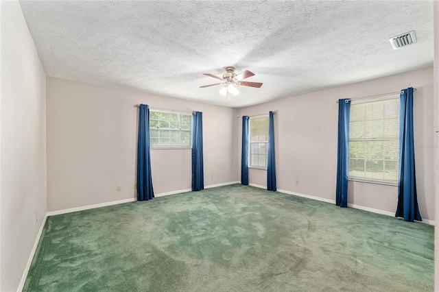 1404 SE 40th Ct, Ocala, FL 34471 - carpeted spare room featuring a ceiling fan, baseboards, and a textured ceiling