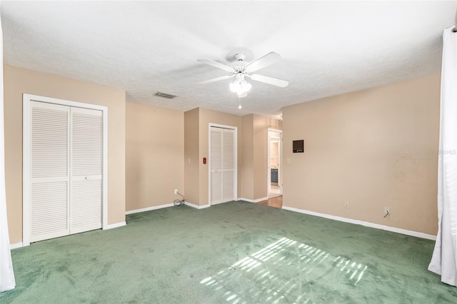 1404 SE 40th Ct, Ocala, FL 34471 - unfurnished bedroom with multiple closets, carpet flooring, baseboards, and ceiling fan