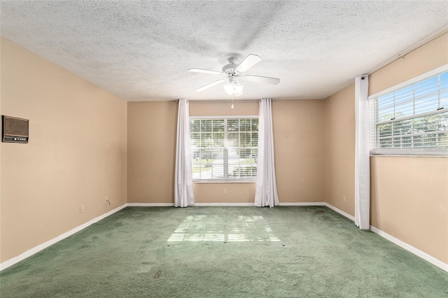 1404 SE 40th Ct, Ocala, FL 34471 - carpeted empty room featuring plenty of natural light, a ceiling fan, baseboards, and a textured ceiling