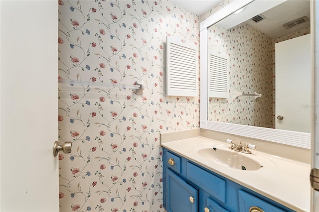 1404 SE 40th Ct, Ocala, FL 34471 - bathroom featuring wallpapered walls and vanity