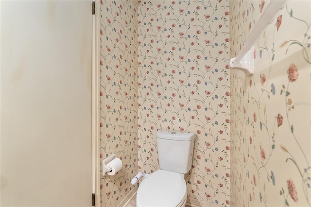 1404 SE 40th Ct, Ocala, FL 34471 - half bath with wallpapered walls, toilet, and baseboards
