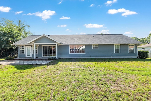 1404 SE 40th Ct, Ocala, FL 34471 - rear view of property featuring a lawn