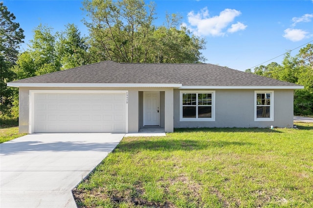 ranch-style home featuring stucco siding, a shingled roof, a front yard, concrete driveway, and an attached garage