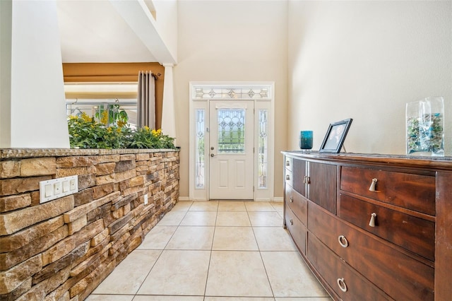 2948 W Henley Ln, Dunnellon, FL 34433 - foyer entrance featuring light tile patterned flooring and a towering ceiling