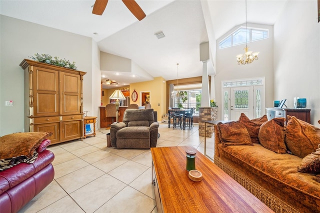 2948 W Henley Ln, Dunnellon, FL 34433 - living area with high vaulted ceiling, light tile patterned floors, a ceiling fan, and a chandelier