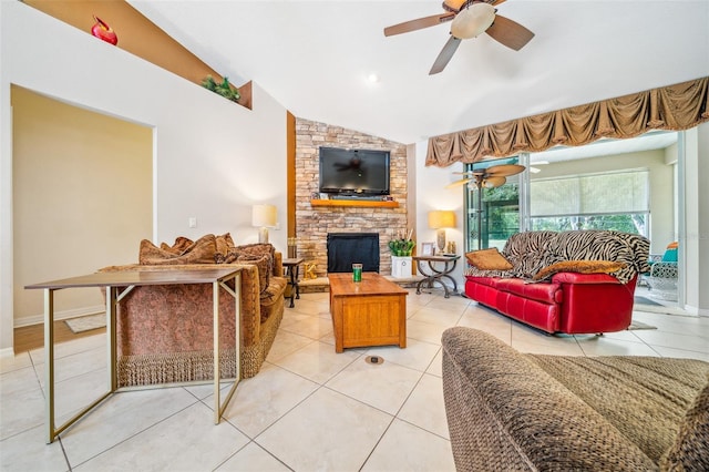 2948 W Henley Ln, Dunnellon, FL 34433 - living area featuring a ceiling fan, a fireplace, vaulted ceiling, and light tile patterned floors