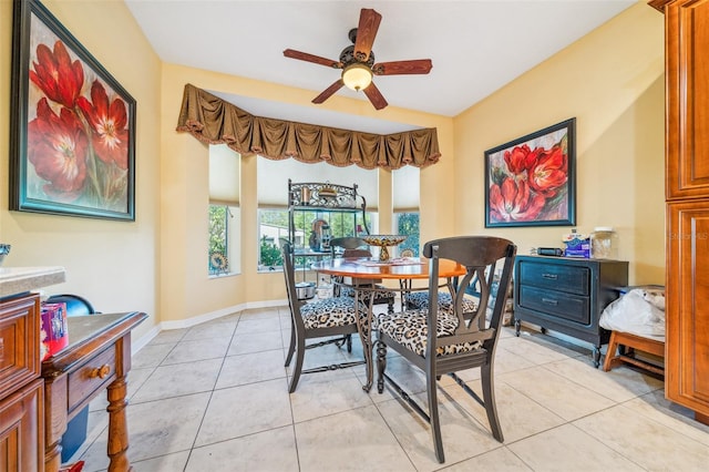 2948 W Henley Ln, Dunnellon, FL 34433 - dining room with a ceiling fan, light tile patterned flooring, and baseboards