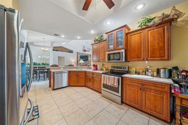 2948 W Henley Ln, Dunnellon, FL 34433 - kitchen with stainless steel appliances, ceiling fan, a peninsula, lofted ceiling, and a sink