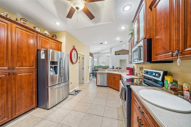 2948 W Henley Ln, Dunnellon, FL 34433 - kitchen with stainless steel appliances, lofted ceiling, light tile patterned floors, light countertops, and ceiling fan