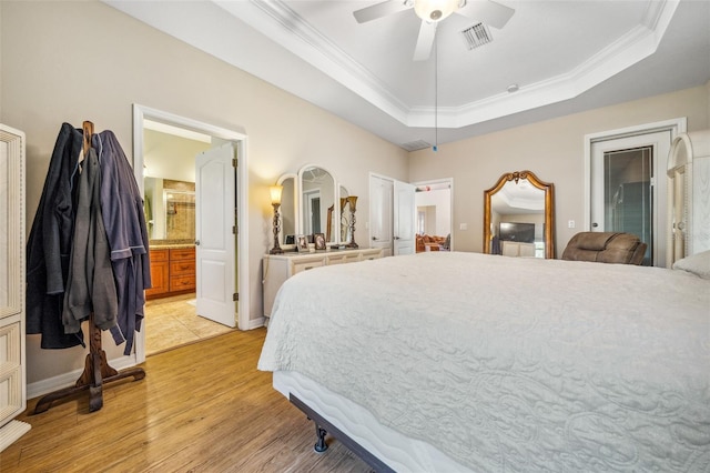 2948 W Henley Ln, Dunnellon, FL 34433 - bedroom with a raised ceiling, light wood finished floors, crown molding, baseboards, and ceiling fan