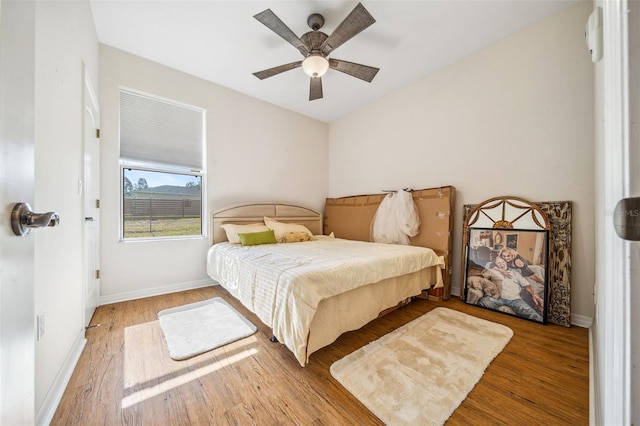 2948 W Henley Ln, Dunnellon, FL 34433 - bedroom with wood finished floors, baseboards, and ceiling fan