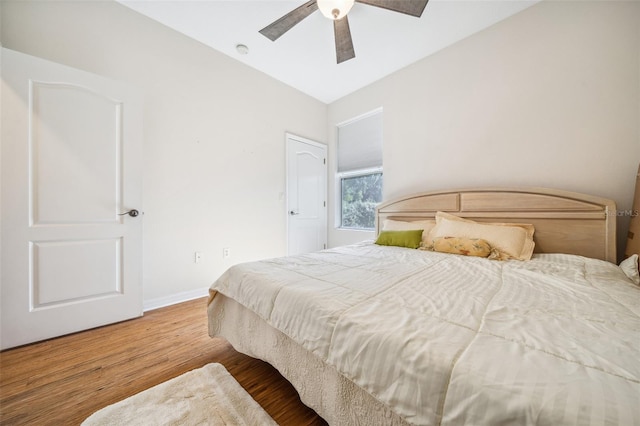 2948 W Henley Ln, Dunnellon, FL 34433 - bedroom featuring wood finished floors, baseboards, and a ceiling fan