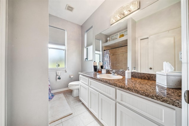 2948 W Henley Ln, Dunnellon, FL 34433 - bathroom with tile patterned flooring, baseboards, toilet, vanity, and a shower with shower curtain