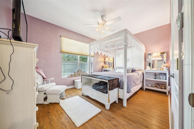 2948 W Henley Ln, Dunnellon, FL 34433 - bedroom with wood finished floors and a ceiling fan