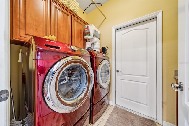 2948 W Henley Ln, Dunnellon, FL 34433 - laundry area with washer and dryer, cabinet space, and light tile patterned floors
