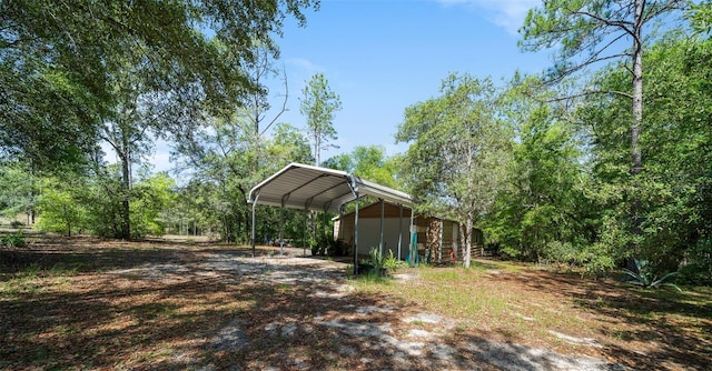 2948 W Henley Ln, Dunnellon, FL 34433 - view of yard with a carport and dirt driveway