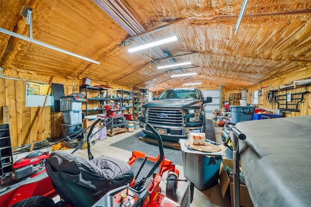 2948 W Henley Ln, Dunnellon, FL 34433 - garage featuring a workshop area and wooden walls