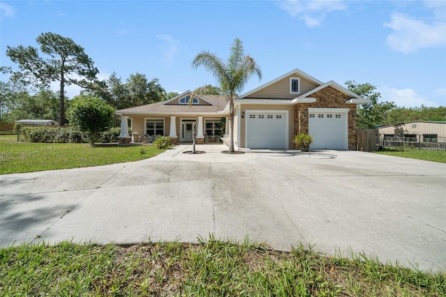 2948 W Henley Ln, Dunnellon, FL 34433 - view of front of house featuring a garage, driveway, and a porch