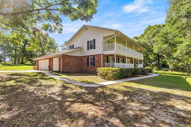20861 SW 81st Loop, Dunnellon, FL 34431 - view of property exterior with brick siding, an attached garage, a lawn, a balcony, and driveway