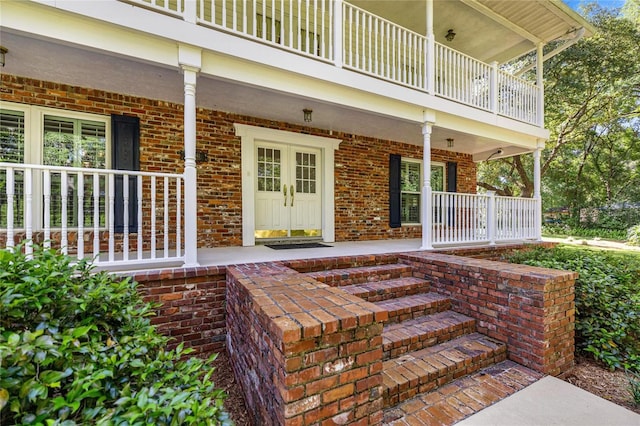 20861 SW 81st Loop, Dunnellon, FL 34431 - property entrance with a porch, a balcony, and brick siding