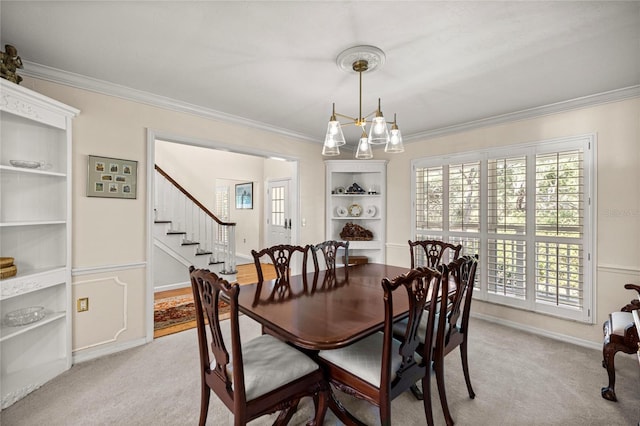 20861 SW 81st Loop, Dunnellon, FL 34431 - dining area with crown molding, stairway, light colored carpet, and a chandelier